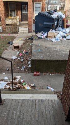 Garbage trailing up to the front door of the unit