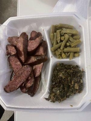 Deer sausage plate with green beans and collard greens.