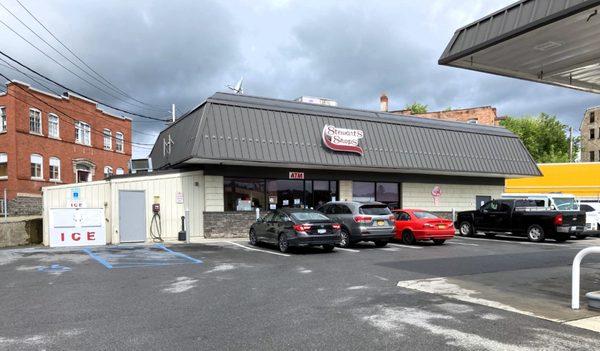 Picture of the shop entrance. The gas pumps are on the right.