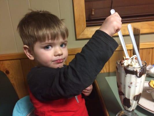 Hot fudge sundae with nuts. Not much different then you would get at McDonald's, but enough for two or three people to share.