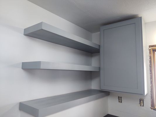 Floating shelves and cabinet.