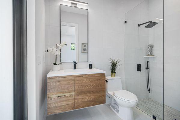 The Logan vanity in Natural Elm promotes a calming, nature-inspired setting