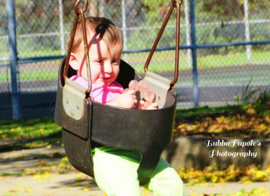 My daughter enjoying swinging