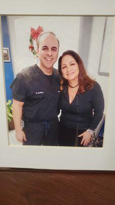 Dr Remy in the office lobby with superstar singer Gloria Estefan after her chiropractic treatment.