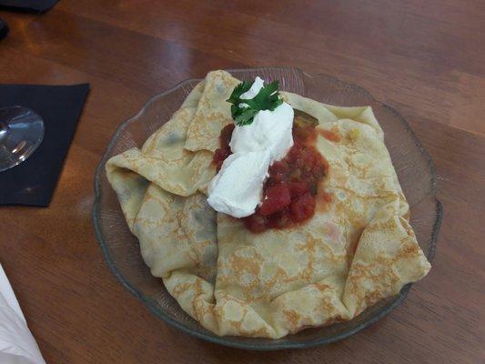 Fiesta crepe with rice, cilantro, black beans and pulled pork. Sour cream and salsa again