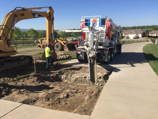 Laying concrete for an energy company.