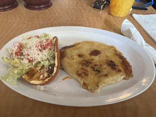 Chicken enchilada on left and pork veggie cheese pupusa on the right