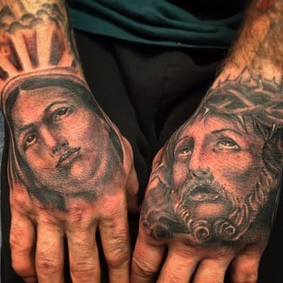 religious hand tattoos done by rick vicious