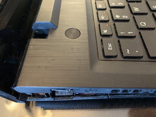 A damaged laptop we repaired. The hinges for the display, the upper case, and the lower case were damaged. (2 of 3)