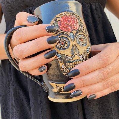 Spooky chic nails by Lauren at Trios, the best salon in Fort Collins, featuring Aveda products & services.