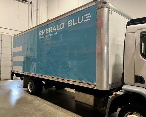 Emerald Blue Workspace Services delivery truck