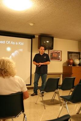 A volunteer talks to visitors