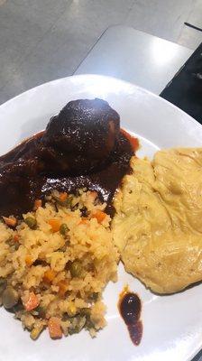 Mole with tamale and rice