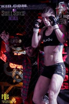 Brittany Elkin's first pro fight- WON- Professor Tony Basile behind cage in her corner