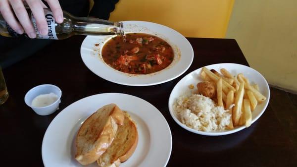 Hangover shrimp.  It came with 1/2 a beer, bread for sopping, rice, fries and hush puppies!