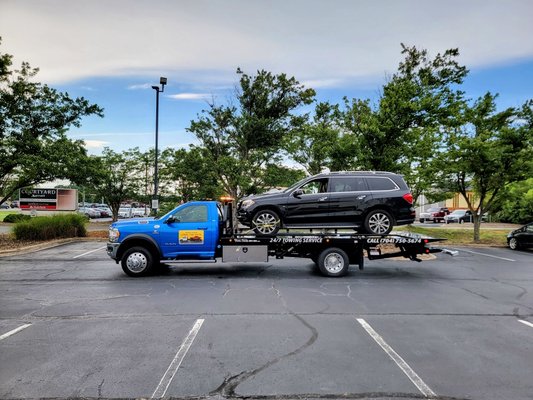 Mercedes being towed by Snoork Towing in Monroe.