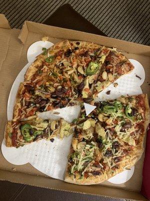 Vegetarian pizza without cheese. Started eating before taking the photo.