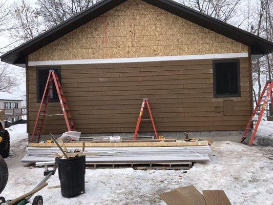 The siding is going onto the new house.