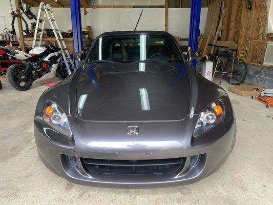 This poor S2K had seen better days... Dents, scratches, torn up roof...