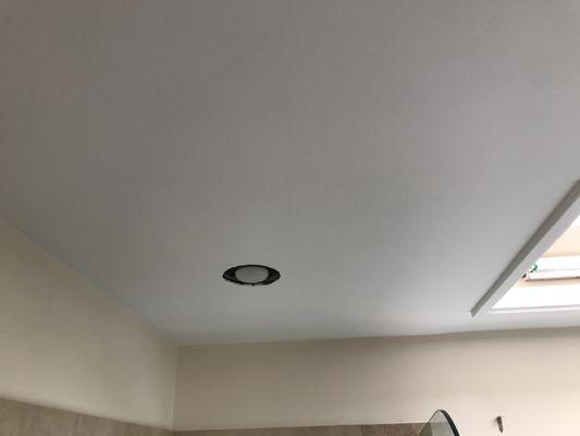 AFTER: spider cracked ceiling in bathroom-- skimmed/recoated drywall, primed and painted