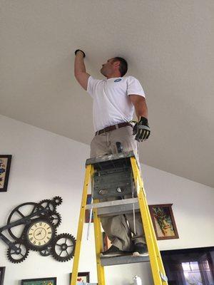 Ceiling fan installation in process