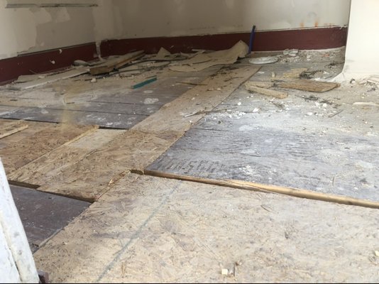 Here's what the subfloor looks like in our bathroom. The floating floor we put above it is ruined regardless of 10 year warranty.