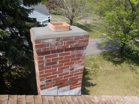 We also do repairs on chimneys. Like this new concrete chimney crown/cap and flue tile replacement. Now this chimney is safe and sound!