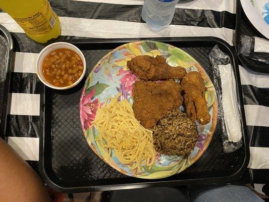 Fried chicken, noodles, rice dressing, and some pork and beans. We also ordered corn bread dressing and that was amazing!