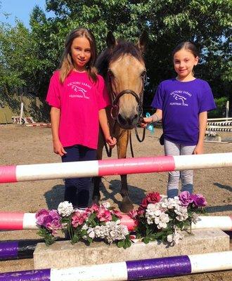 Two of our young riders with our pony Buck.