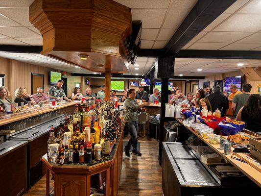 Full stocked bar with multiple choices in liquor and beer.