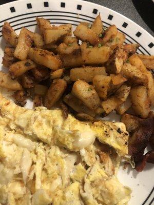 Scrambled eggs with American cheese and breakfast potatoes