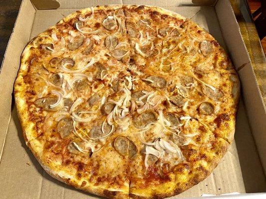 Large pie with sausage and onion