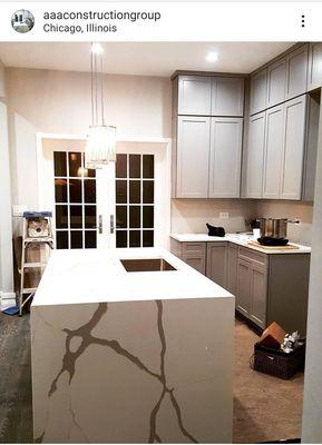 Fully gutted and rehabbed kitchen with beautiful custom waterfall counter tops!