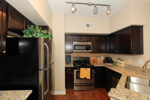 The medium 1x1 kitchen, granite counter tops, deep sinks, espresso cabinets, stainless appliances