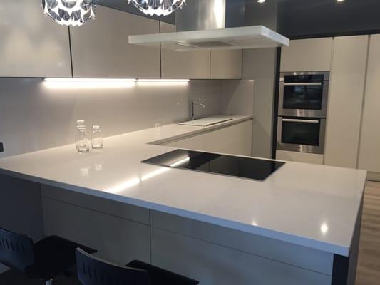 Scavolini kitchen with Veined Michelangelo countertop and backsplash.