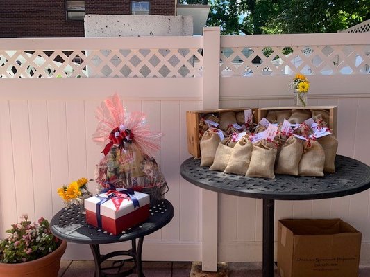 Co-branded goody bags for all guests and super cute themed gift baskets we raffled off. The Clients loved them all!