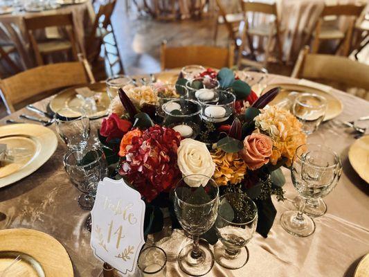 Low fresh flower centerpiece with floating candles