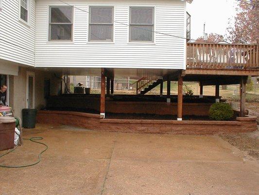 Under addition retaining wall.