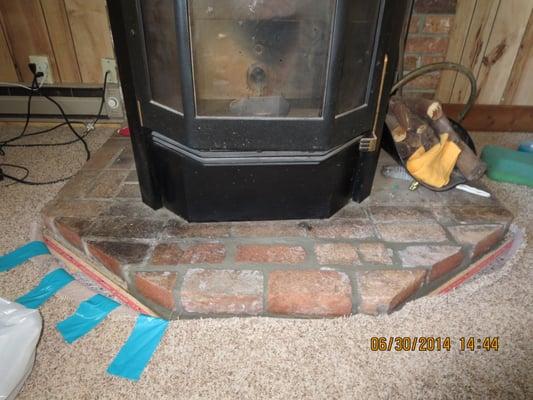 Brick and mortar, surrounded by newly installed carpet.