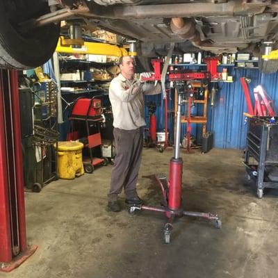 Lead Technician and ASE Certified Master Technician Jesse Gordon getting ready to pull a transmission.