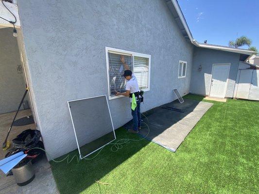 The installation of the artificial turf window film at my home in San Marcos