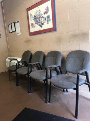 Small waiting room. 6 chairs and a TV