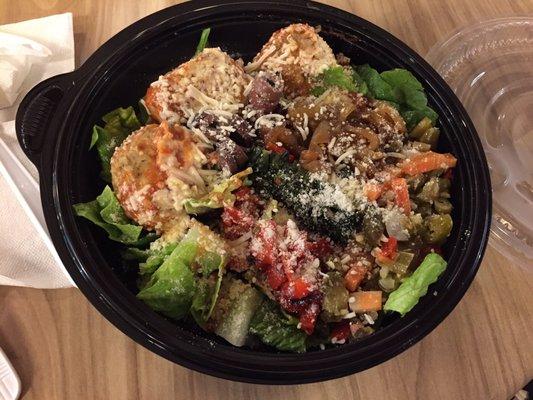 Trio of chicken meatballs with a base of salad with all the toppings