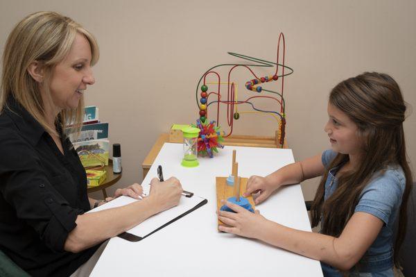 Psychometrist administering a test to a child