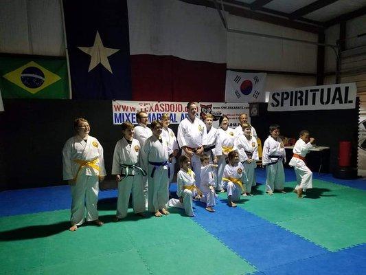 A few happy students posing for pictures after rank promotion