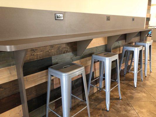 Bar seating with outlets and USB ports for charging all of your devices.