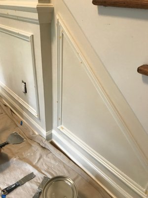 Middle process of Wainscoting project; oil primer coat, Swedish Putty coat followed by another oil primer coat.