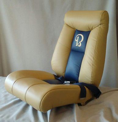 Custom Beechcraft seat with monogram logo done in camel and blue leather.