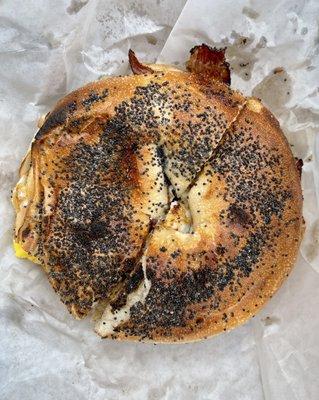 Pastrami and egg on poppy seed bagel