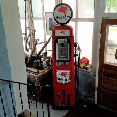 restored gas pump that used to sit outside before this became a museum